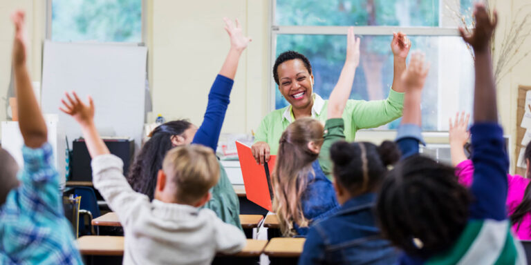 photo - African American Teacher Reading to School Children