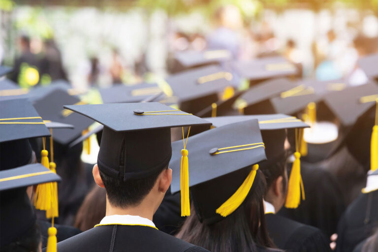 photo - Back of Graduates Wearing Mortar Boards