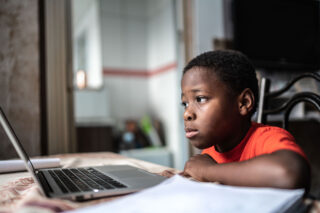 photo - A Boy Distance Learning and Using Laptop