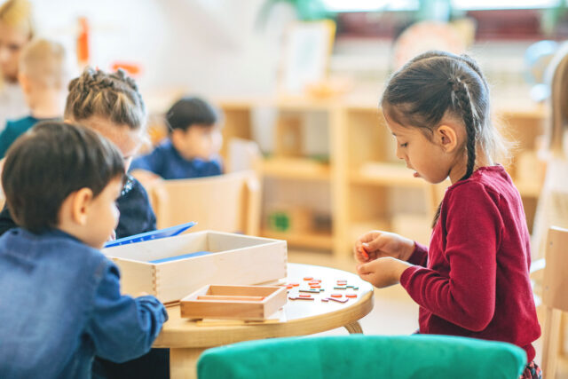 photo - Children Playing in Preschool Classroom