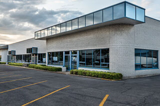 photo - Closed Small Business with Empty Parking Lot