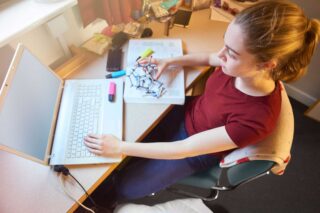 photo - College Student Online Learning from Dorm Room