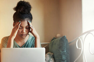 photo - College Student Studying at Home on Laptop