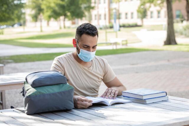 photo - College Student Studying Outdoors