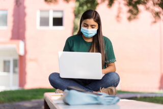 photo - College Student Studying Outside on Campus