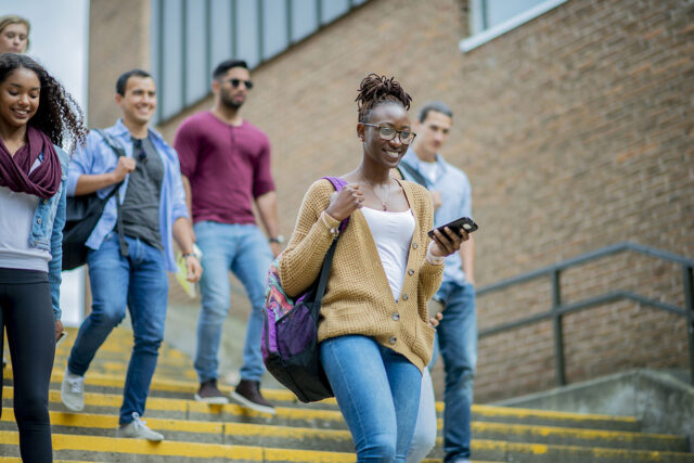 photo - College Students Walking Down Stairs