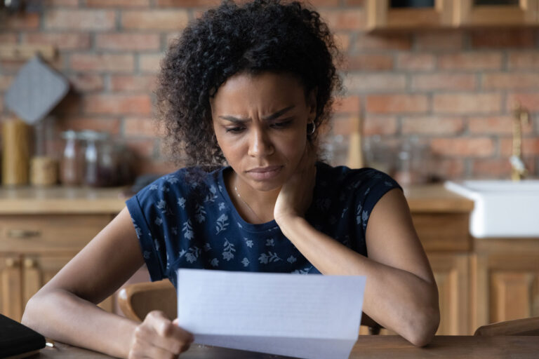 photo - Concerned Woman Reading Bill