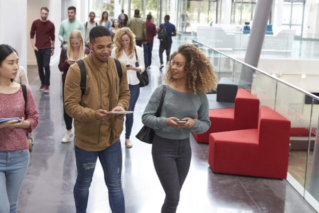 photo- Diverse Students Walking and Talking