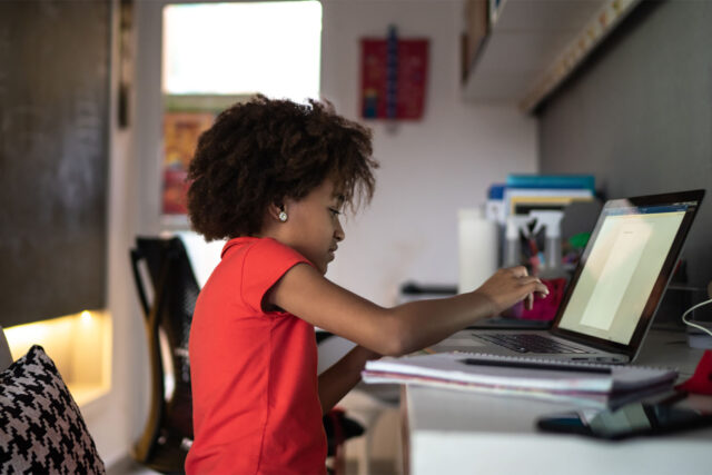 photo - Elementary Girl Studying on Laptop