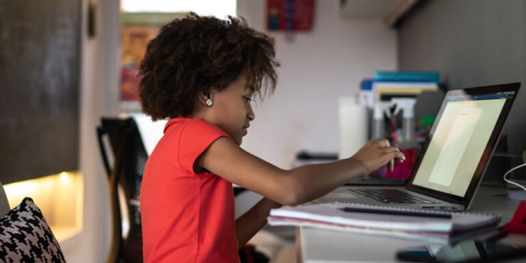 photo - Elementary Girl Studying on a Laptop