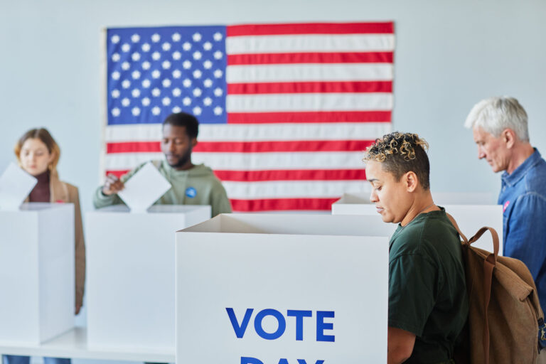 photo - Four People Voting at Poll