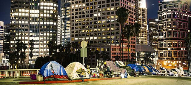 photo - Homelss Tents Beside Skyscrapers in Los Angeles Downtown at Night