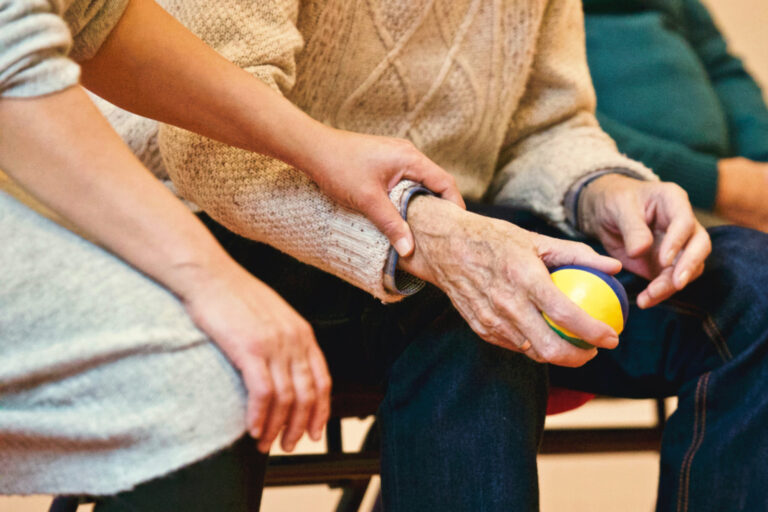 photo - Person Holding a Stress Ball