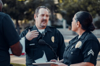 photo - Police Officers Talking to Each Other