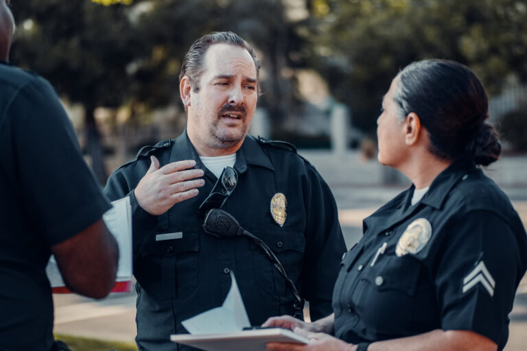 photo - Police Officers Talking to Each Other