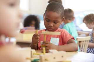 photo - Preschool Boy Playing with Blocks