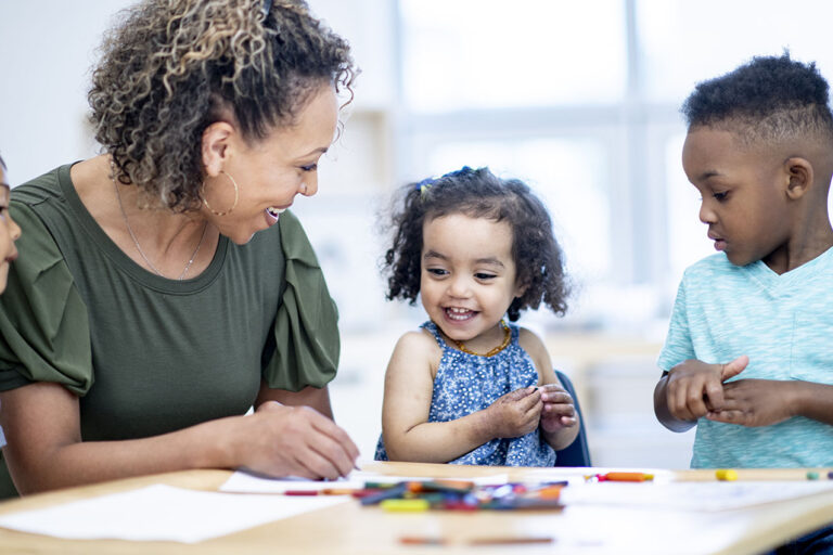 photo - Preschool Students and Teacher Coloring