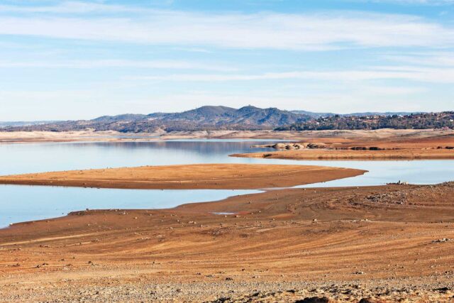 photo - Sandy Shoreline of Lake with Low Water Level