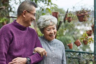 photo - Senior Couple Walking Together