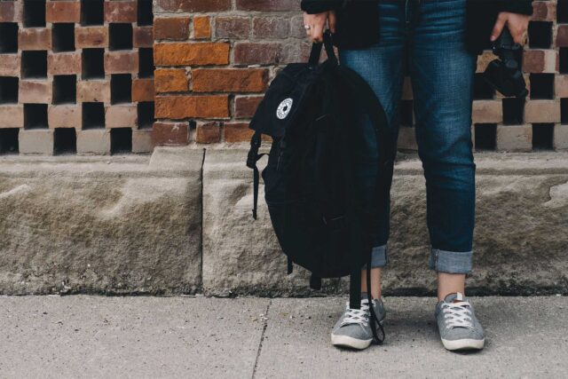 photo - Student Holding Backpack