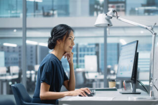 photo - Tech Employee Working at Computer