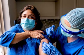 photo - Woman Being Vaccinated