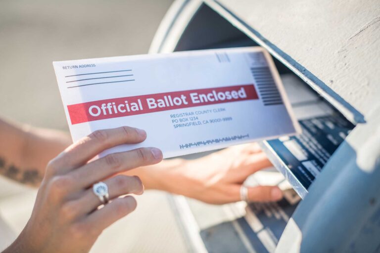 photo - Woman Mailing her Ballot