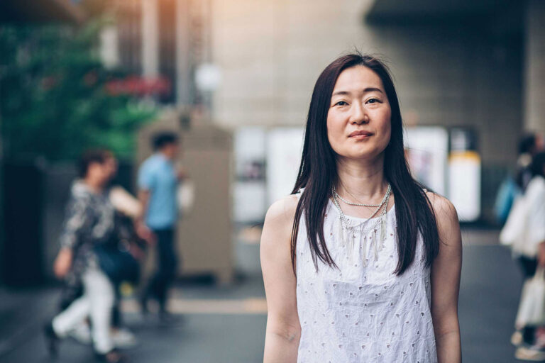 photo - Woman Standing Outdoors