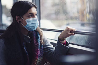photo - Woman Wearing Mask on Bus