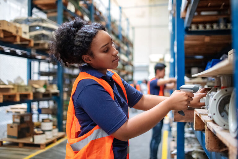 photo - Woman Working in a Packaging Warehouse