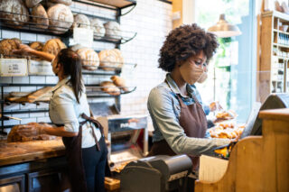 photo - People working in cafe wearing face masks