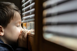 Photo of young boy at the window