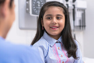 photo - Young girl visiting the pediatrician