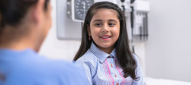 photo - Young girl visiting the pediatrician