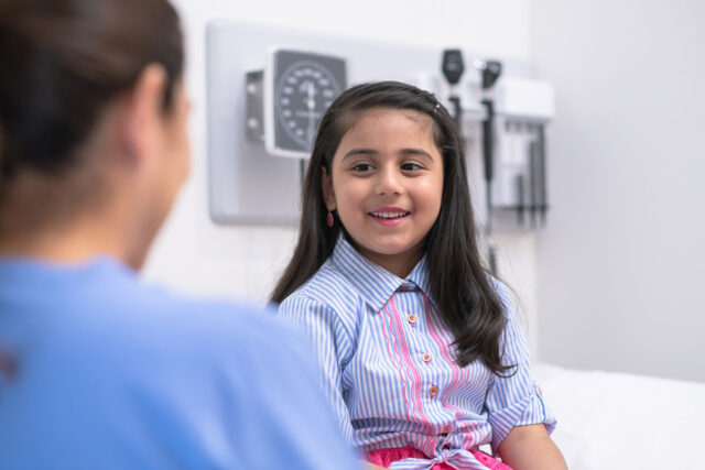 photo - Young Girl Visiting Pediatrician