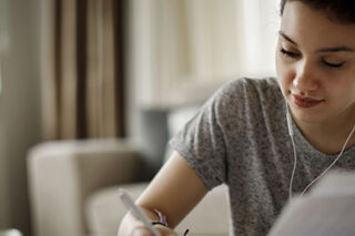 photo - Young Woman Studying at Home